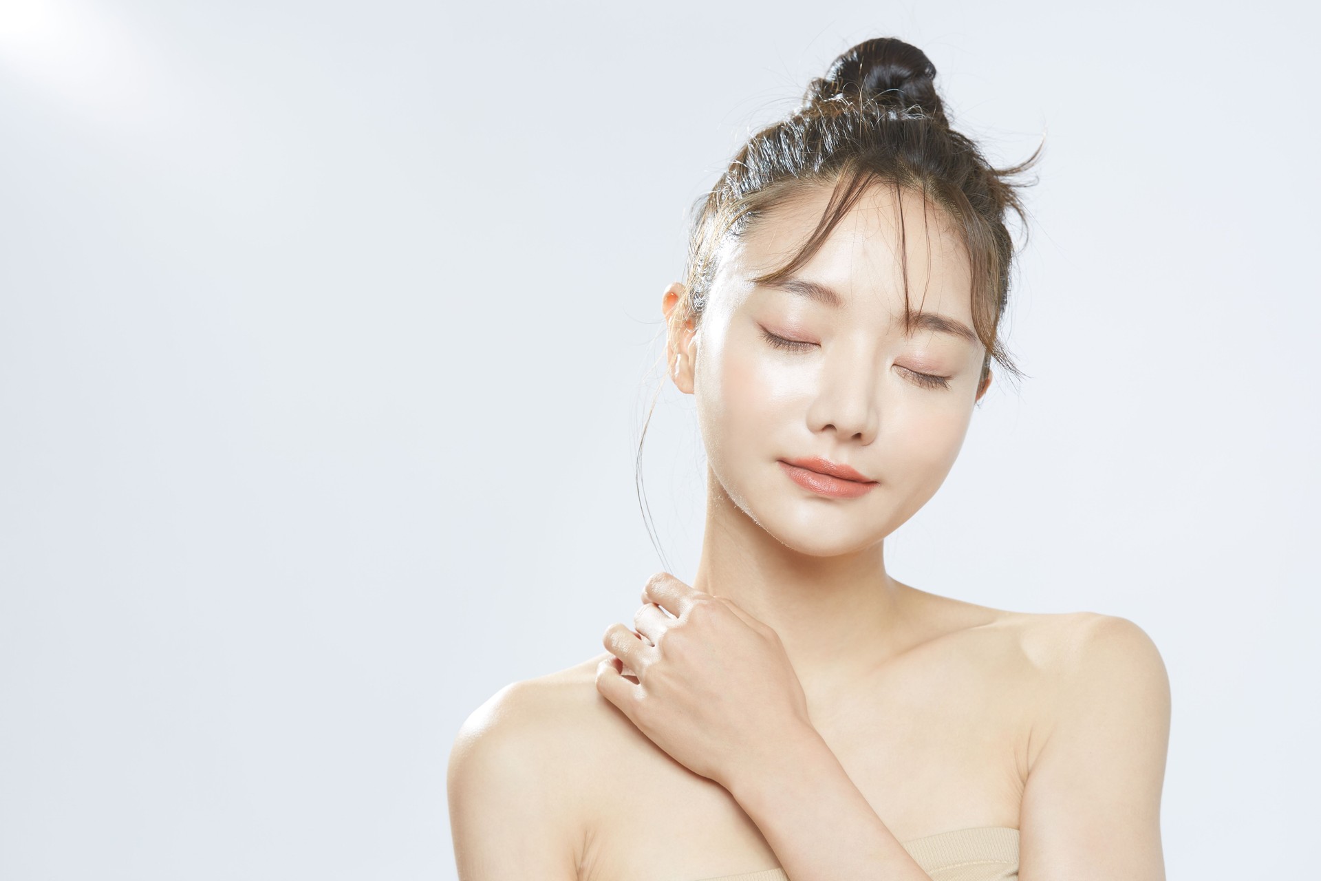 Beauty concept portrait of young Asian woman with soft highlighting