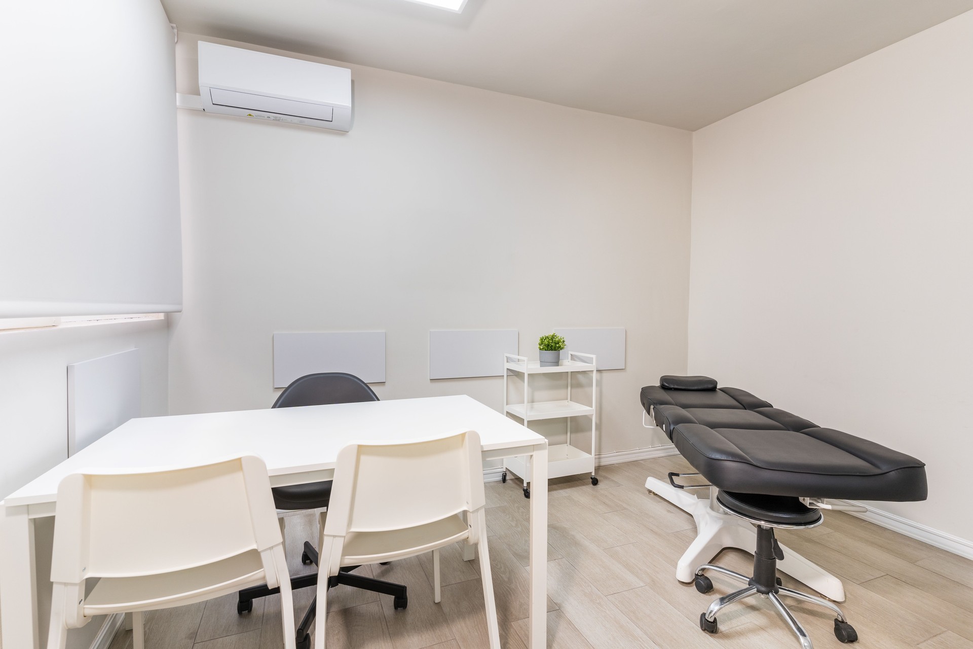 Modern treatment room minimalist medical consultation and examination space.